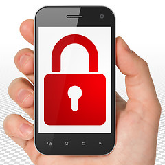Image showing Privacy concept: Hand Holding Smartphone with Closed Padlock on display