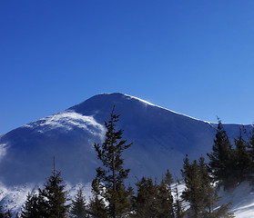 Image showing Winter mountains at sunny windy day