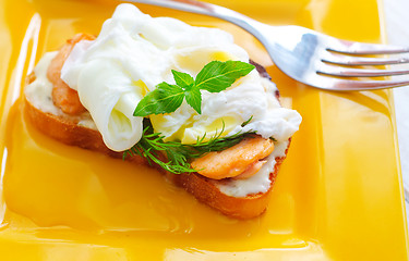 Image showing Close Up of Poached Delicious Egg with Whole Grain Bread