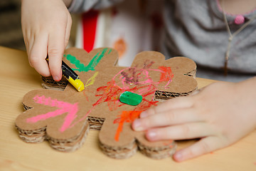 Image showing Little female baby painting with colorful paints