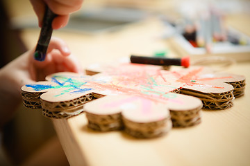 Image showing Little female baby painting with colorful paints