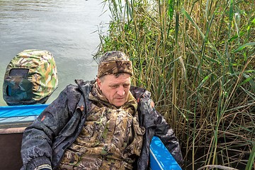 Image showing Fisherman in boat  