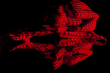 Image showing The  body of woman with red pattern and its reflection