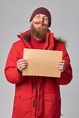 Image showing Man wearing red winter Alaska jacket  with fur hood on