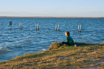 Image showing boy looking over lake