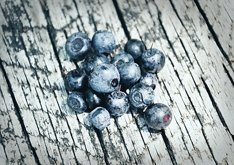 Image showing Bilberries on wood