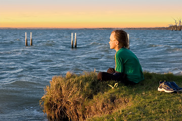 Image showing boy looking over lake