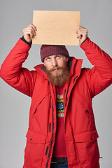 Image showing Man wearing red winter Alaska jacket  with fur hood on