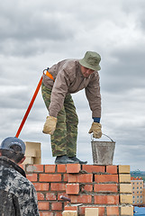 Image showing Bricklayer on house construction