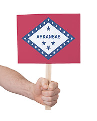 Image showing Hand holding small card - Flag of Arkansas