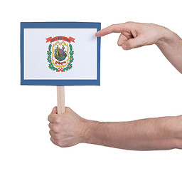 Image showing Hand holding small card - Flag of West Virginia