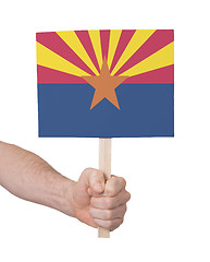 Image showing Hand holding small card - Flag of Arizona