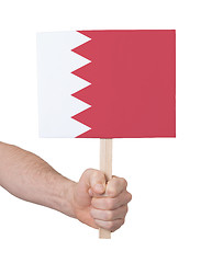 Image showing Hand holding small card - Flag of Bahrain