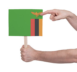 Image showing Hand holding small card - Flag of Zambia