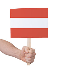 Image showing Hand holding small card - Flag of Austria