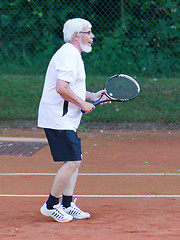 Image showing Senior man playing tennis