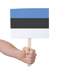 Image showing Hand holding small card - Flag of Estonia