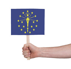 Image showing Hand holding small card - Flag of Indiana