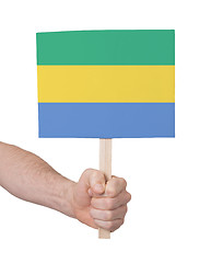 Image showing Hand holding small card - Flag of Gabon