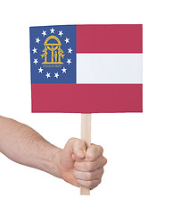 Image showing Hand holding small card - Flag of Georgia