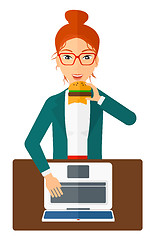 Image showing Woman eating hamburger. 