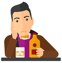 Image showing Sad man with bottle and glass.