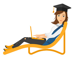 Image showing Graduate lying in chaise lounge with laptop.