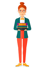 Image showing Woman holding pile of books.