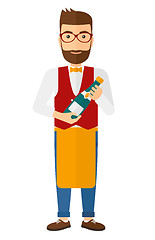 Image showing Waiter holding bottle of wine.