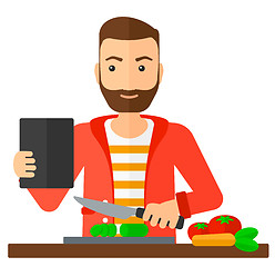 Image showing Man cooking meal.