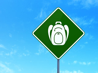 Image showing Travel concept: Backpack on road sign background