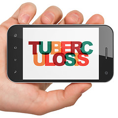 Image showing Medicine concept: Hand Holding Smartphone with Tuberculosis on  display