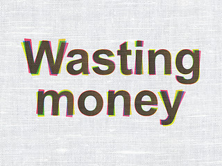 Image showing Money concept: Wasting Money on fabric texture background