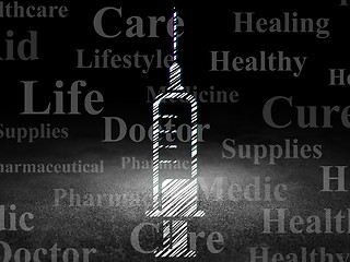 Image showing Medicine concept: Syringe in grunge dark room