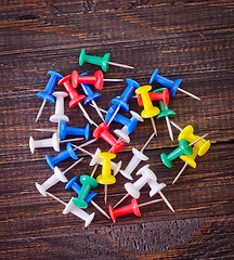 Image showing color paper on wooden background