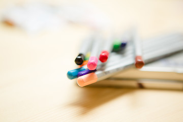 Image showing Close up of color pencils over wooden background