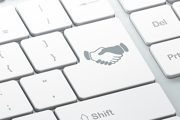 Image showing Business concept: Handshake on computer keyboard background