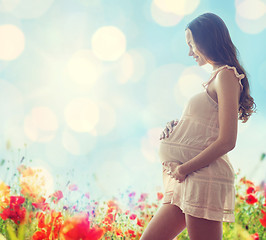 Image showing happy pregnant woman in chemise