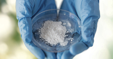 Image showing close up of scientist hands holding petri dish