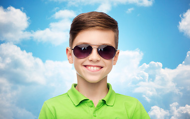 Image showing smiling boy in sunglasses and green polo t-shirt