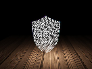 Image showing Protection concept: Shield in grunge dark room