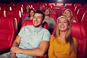 Image showing happy friends watching movie in theater