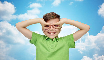 Image showing happy boy in t-shirt having fun and making faces