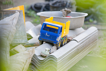 Image showing Old toy truck lay on a pile of slate