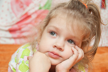 Image showing The three-year girl interested looking at left