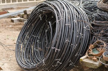 Image showing Pile of old wires lying on the ground