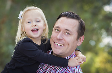 Image showing Adorable Little Girl Having Fun With Daddy Outdoors