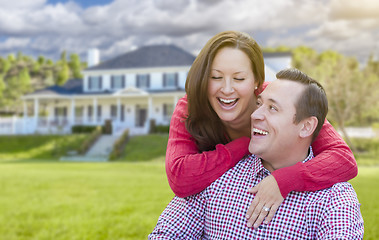 Image showing Happy Couple Outdoors In Front of Beautiful House