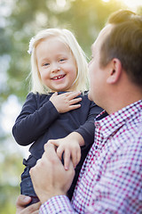 Image showing Adorable Little Girl Having Fun With Daddy Outdoors