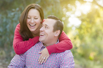 Image showing Attractive Caucasian Couple Laughing Outdoors